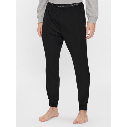 Calvin Klein Underwear Spodnie piżamowe 000NM2235A Czarny Regular Fit ze sklepu MODIVO w kategorii Piżamy męskie - zdjęcie 182596761
