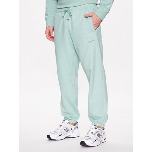 New Balance Spodnie dresowe MP23551 Zielony Relaxed Fit ze sklepu MODIVO w kategorii Spodnie męskie - zdjęcie 182598514