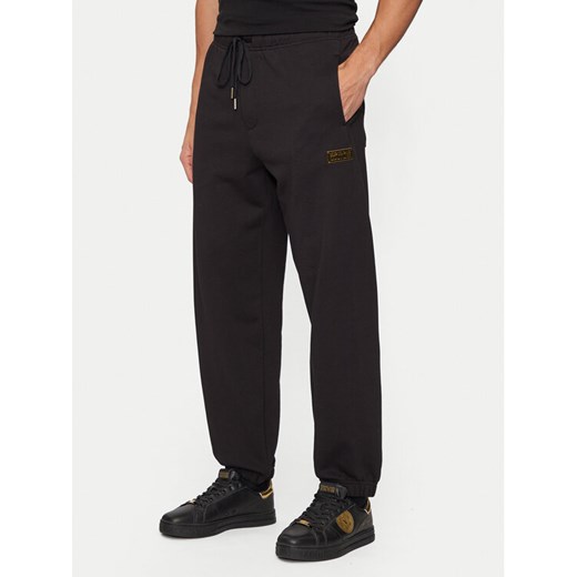 Versace Jeans Couture Spodnie dresowe 77GAAT08 Czarny Regular Fit ze sklepu MODIVO w kategorii Spodnie męskie - zdjęcie 182602940