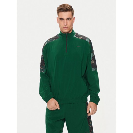 Reebok Bluza Train Motion 100075353 Zielony Relaxed Fit ze sklepu MODIVO w kategorii Bluzy męskie - zdjęcie 182604392