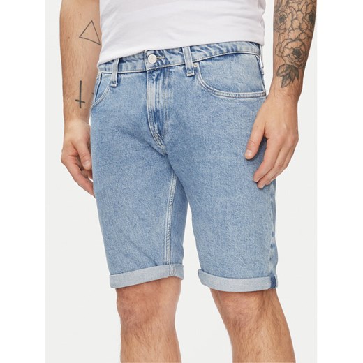Tommy Jeans Szorty jeansowe Ronnie DM0DM19154 Niebieski Slim Fit ze sklepu MODIVO w kategorii Spodenki męskie - zdjęcie 182605202