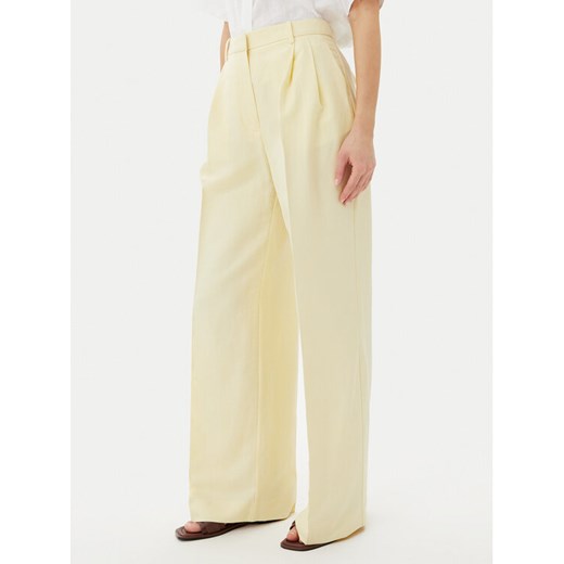 Tommy Hilfiger Spodnie materiałowe WW0WW45460 Żółty Relaxed Fit ze sklepu MODIVO w kategorii Spodnie damskie - zdjęcie 182606203