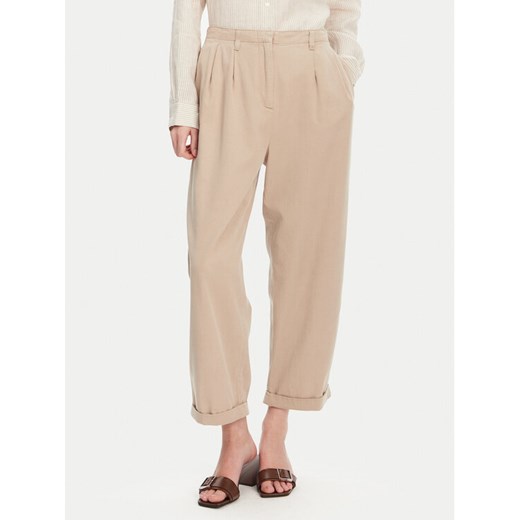 Tommy Hilfiger Spodnie materiałowe WW0WW45589 Beżowy Relaxed Fit ze sklepu MODIVO w kategorii Spodnie damskie - zdjęcie 182607810