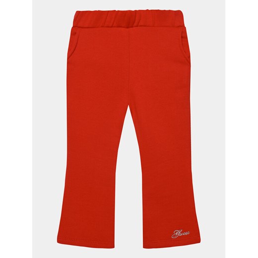 Guess Spodnie materiałowe K3BQ12 KAD74 Czerwony Relaxed Fit ze sklepu MODIVO w kategorii Spodnie dziewczęce - zdjęcie 182608102