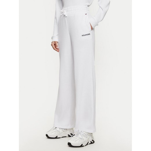 Tommy Hilfiger Spodnie dresowe UW0UW05577 Biały Relaxed Fit ze sklepu MODIVO w kategorii Spodnie damskie - zdjęcie 182608640