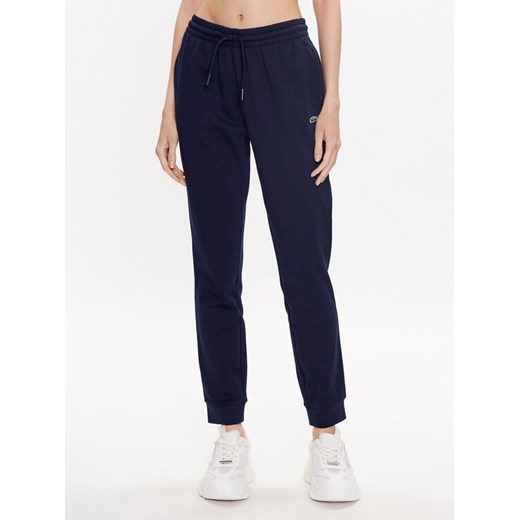 Lacoste Spodnie dresowe XF9216 Granatowy Regular Fit ze sklepu MODIVO w kategorii Spodnie damskie - zdjęcie 182608850
