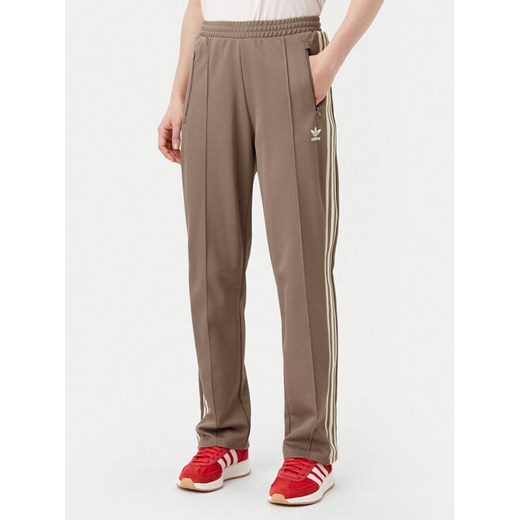 adidas Spodnie dresowe Beckenbauer JC5792 Beżowy Regular Fit ze sklepu MODIVO w kategorii Spodnie damskie - zdjęcie 182610934