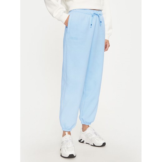 Under Armour Spodnie dresowe UA Icon Fleece 1386503 Niebieski Oversize ze sklepu MODIVO w kategorii Spodnie damskie - zdjęcie 182610942