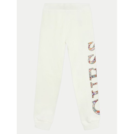 Guess Spodnie dresowe J4BQ11 KAX73 Écru Relaxed Fit ze sklepu MODIVO w kategorii Spodnie dziewczęce - zdjęcie 182613482