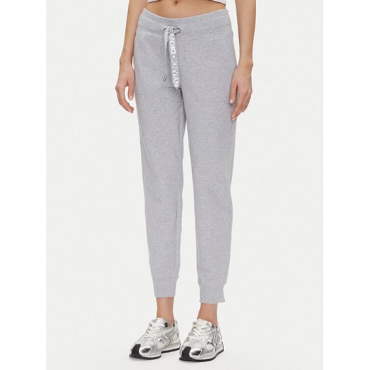 DKNY Sport Spodnie dresowe DP5P3496 Szary Regular Fit ze sklepu MODIVO w kategorii Spodnie damskie - zdjęcie 182613814