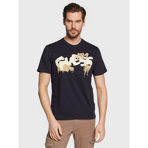 Guess T-Shirt Graffiti Logo M3GI59 K9RM1 Granatowy Slim Fit ze sklepu MODIVO w kategorii T-shirty męskie - zdjęcie 182614232