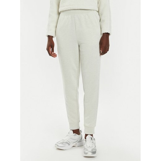 Calvin Klein Performance Spodnie dresowe 00GWS4P651 Beżowy Relaxed Fit ze sklepu MODIVO w kategorii Spodnie damskie - zdjęcie 182615822