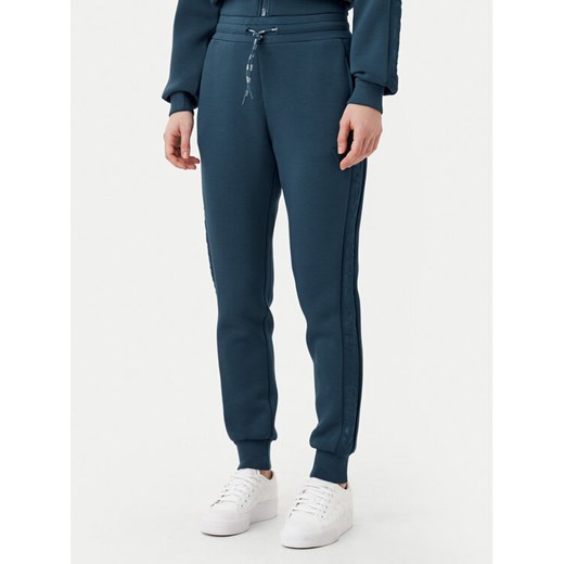 Guess Spodnie dresowe V2YB18 K7UW2 Niebieski Regular Fit ze sklepu MODIVO w kategorii Spodnie damskie - zdjęcie 182616443
