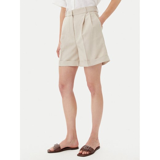 Tommy Hilfiger Szorty materiałowe WW0WW44767 Beżowy Regular Fit ze sklepu MODIVO w kategorii Szorty - zdjęcie 182617220