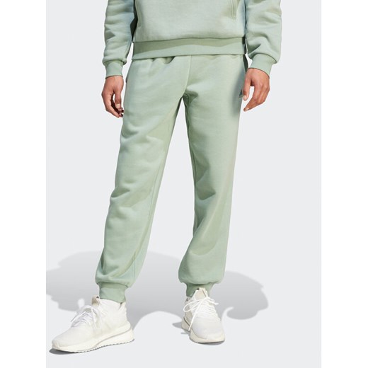 adidas Spodnie dresowe IR8361 Zielony Regular Fit ze sklepu MODIVO w kategorii Spodnie męskie - zdjęcie 182619963