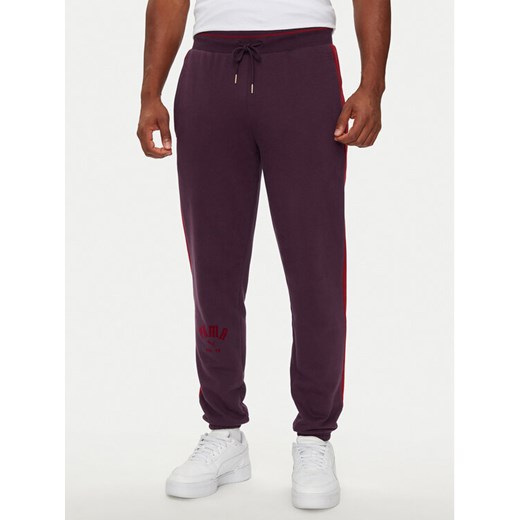 Puma Spodnie dresowe T7 PLAY.PARIS 626768 44 Czarny Regular Fit ze sklepu MODIVO w kategorii Spodnie męskie - zdjęcie 182620140