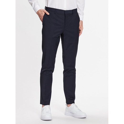 Hugo Spodnie garniturowe 50446526 Granatowy Slim Fit ze sklepu MODIVO w kategorii Spodnie męskie - zdjęcie 182620282