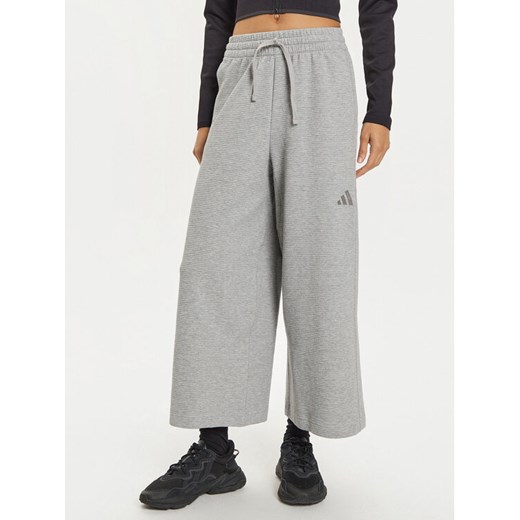 adidas Spodnie dresowe ALL SZN IY6830 Szary Wide Leg ze sklepu MODIVO w kategorii Spodnie damskie - zdjęcie 182620624
