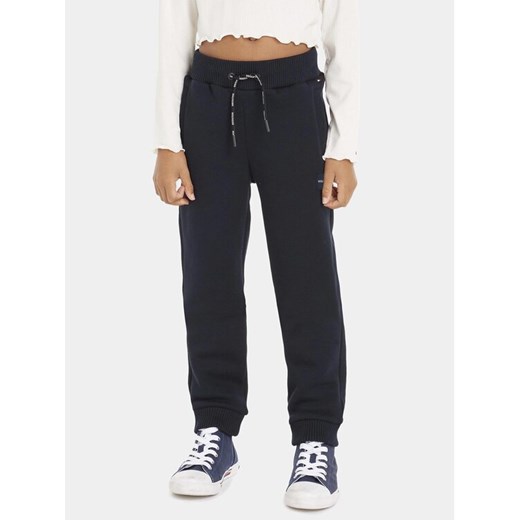 Tommy Hilfiger Spodnie dresowe KB0KB08278 D Niebieski Regular Fit ze sklepu MODIVO w kategorii Spodnie chłopięce - zdjęcie 182622761