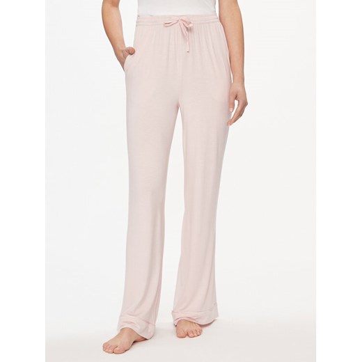 Tommy Hilfiger Spodnie dresowe UW0UW05195 Różowy Relaxed Fit ze sklepu MODIVO w kategorii Spodnie damskie - zdjęcie 182622980