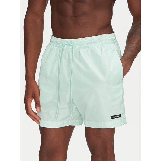 Calvin Klein Swimwear Szorty kąpielowe KM0KM01111 Zielony Regular Fit ze sklepu MODIVO w kategorii Kąpielówki - zdjęcie 182625890