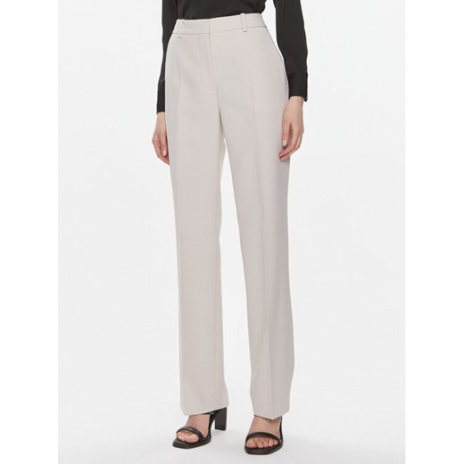 Calvin Klein Spodnie materiałowe Essential K20K206879 Szary Slim Fit ze sklepu MODIVO w kategorii Spodnie damskie - zdjęcie 182626701