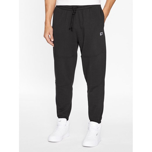 Puma Spodnie dresowe Downtown 621287 01 Czarny Regular Fit ze sklepu MODIVO w kategorii Spodnie męskie - zdjęcie 182627784