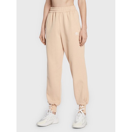 adidas Spodnie dresowe Always Original Laced HK5065 Beżowy Regular Fit ze sklepu MODIVO w kategorii Spodnie damskie - zdjęcie 182628570