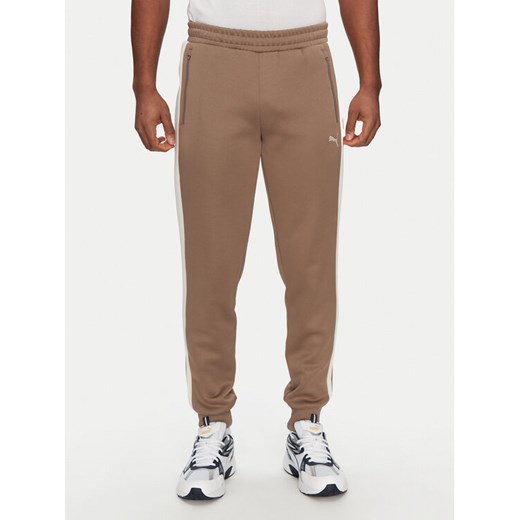 Puma Spodnie dresowe T7 Always On 629588 Brązowy Regular Fit ze sklepu MODIVO w kategorii Spodnie męskie - zdjęcie 182629842