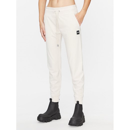 DKNY Sport Spodnie dresowe DP3P1854 Beżowy Regular Fit ze sklepu MODIVO w kategorii Spodnie damskie - zdjęcie 182630203