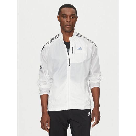 adidas Kurtka do biegania Own the Run 3-Stripes JD7760 Biały Slim Fit ze sklepu MODIVO w kategorii Kurtki męskie - zdjęcie 182630331