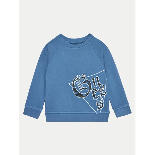 Guess Bluza N4BQ00 KAD74 Granatowy Regular Fit ze sklepu MODIVO w kategorii Bluzy chłopięce - zdjęcie 182630922