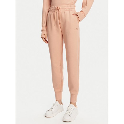 Lacoste Spodnie dresowe XF0343 Pomarańczowy Regular Fit ze sklepu MODIVO w kategorii Spodnie damskie - zdjęcie 182631120