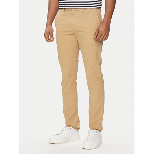 Tommy Hilfiger Chinosy Bleecker MW0MW26619 Beżowy Slim Fit ze sklepu MODIVO w kategorii Spodnie męskie - zdjęcie 182634824