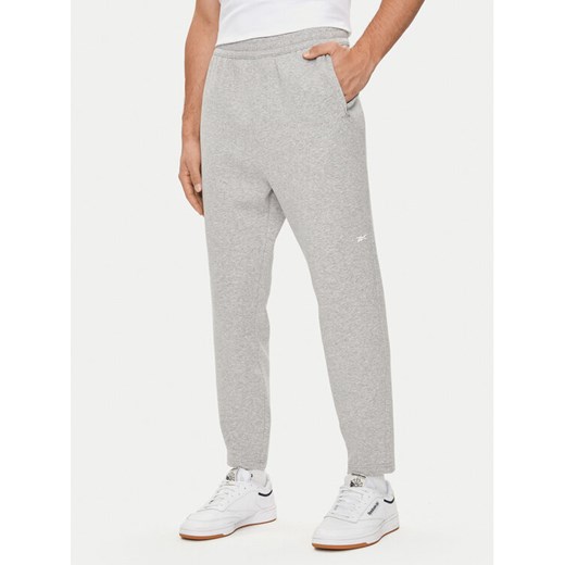 Reebok Spodnie dresowe Activ Coll Dreamblend 100075606 Szary Regular Fit ze sklepu MODIVO w kategorii Spodnie męskie - zdjęcie 182635711