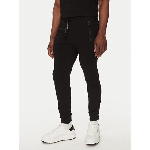 Armani Exchange Spodnie dresowe 8NZP73 ZJKRZ 1200 Czarny Regular Fit ze sklepu MODIVO w kategorii Spodnie męskie - zdjęcie 182636490