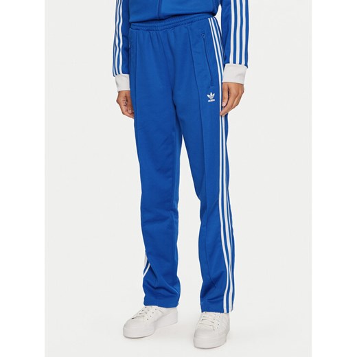 adidas Spodnie dresowe Beckenbauer IY2228 Niebieski Regular Fit ze sklepu MODIVO w kategorii Spodnie damskie - zdjęcie 182638603