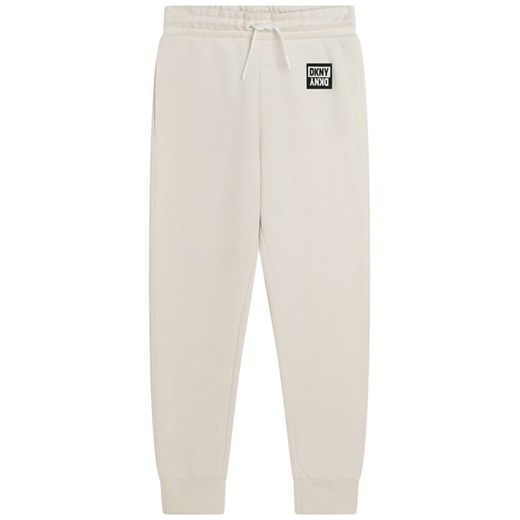 DKNY Spodnie dresowe D34A85 S Biały Regular Fit ze sklepu MODIVO w kategorii Spodnie dziewczęce - zdjęcie 182639513