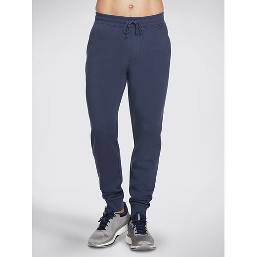 Skechers Spodnie dresowe Sweats Essential Jogger PT16 Szary Regular Fit ze sklepu MODIVO w kategorii Spodnie męskie - zdjęcie 182639681