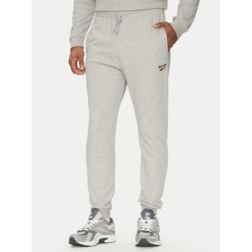 Reebok Spodnie dresowe 100221804 Szary Regular Fit ze sklepu MODIVO w kategorii Spodnie męskie - zdjęcie 182640374