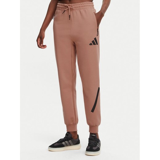 adidas Spodnie dresowe Z.N.E. JD5995 Różowy Regular Fit ze sklepu MODIVO w kategorii Spodnie damskie - zdjęcie 182640920