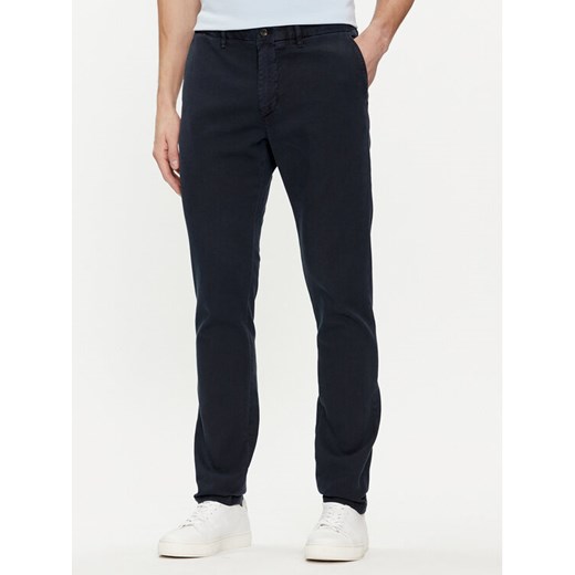 Tommy Hilfiger Chinosy Bleecker MW0MW33910 Granatowy Slim Fit ze sklepu MODIVO w kategorii Spodnie męskie - zdjęcie 182643920