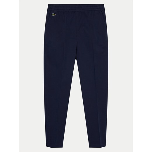 Lacoste Chinosy HJ9701 Granatowy Regular Fit ze sklepu MODIVO w kategorii Spodnie chłopięce - zdjęcie 182644292