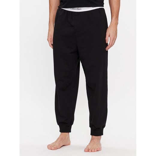 Calvin Klein Underwear Spodnie piżamowe 000NM2302E Czarny Regular Fit ze sklepu MODIVO w kategorii Piżamy męskie - zdjęcie 182646720