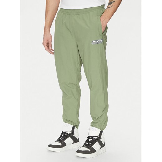 Karl Kani Joggery Essentia 60060039 Zielony Regular Fit ze sklepu MODIVO w kategorii Spodnie męskie - zdjęcie 182647880