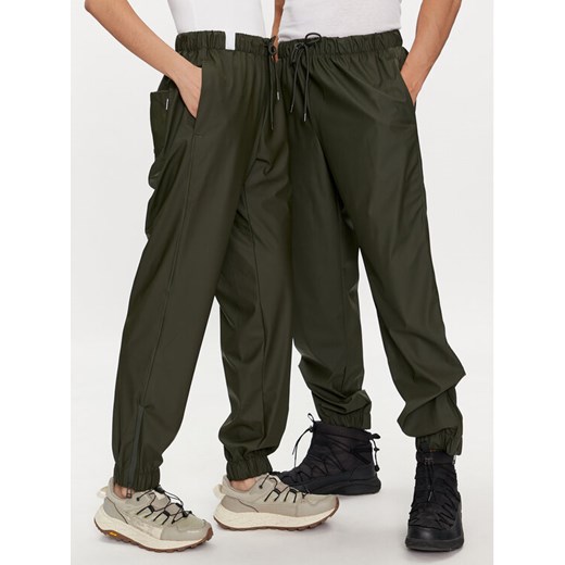 Rains Spodnie przeciwdeszczowe Rain Pants Regular W3 18560 Zielony Regular Fit ze sklepu MODIVO w kategorii Spodnie damskie - zdjęcie 182648574