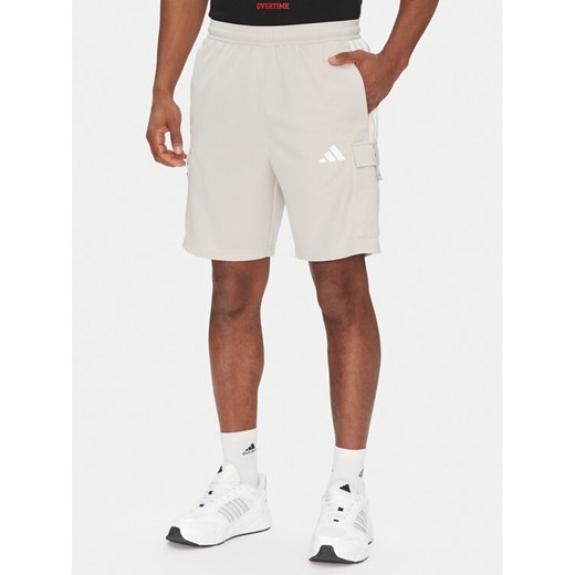 adidas Szorty sportowe Tiro Cargo JC7958 Beżowy Regular Fit ze sklepu MODIVO w kategorii Spodenki męskie - zdjęcie 182648854