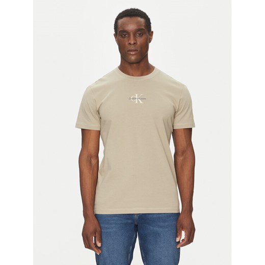 Calvin Klein Jeans T-Shirt Monologo J30J325649 Beżowy Regular Fit ze sklepu MODIVO w kategorii T-shirty męskie - zdjęcie 182649461