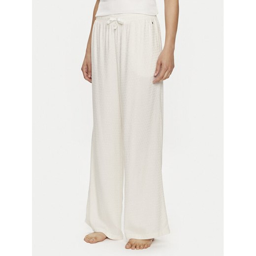 Tommy Hilfiger Spodnie piżamowe UW0UW05230 Écru Relaxed Fit ze sklepu MODIVO w kategorii Piżamy damskie - zdjęcie 182650104