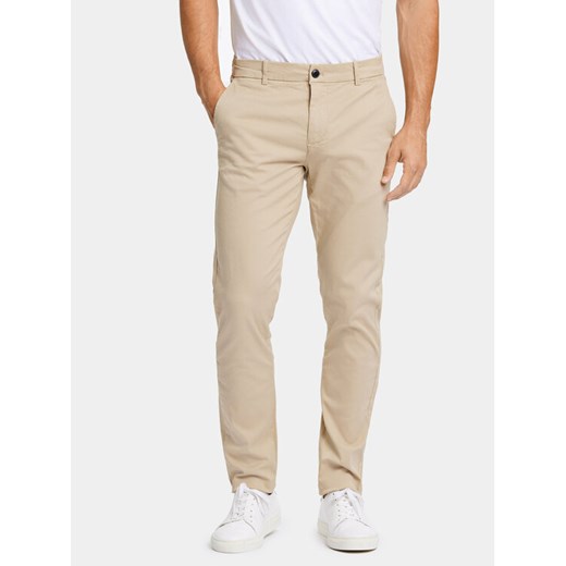 Lindbergh Chinosy 30-005044 Beżowy Slim Fit ze sklepu MODIVO w kategorii Spodnie męskie - zdjęcie 182650594